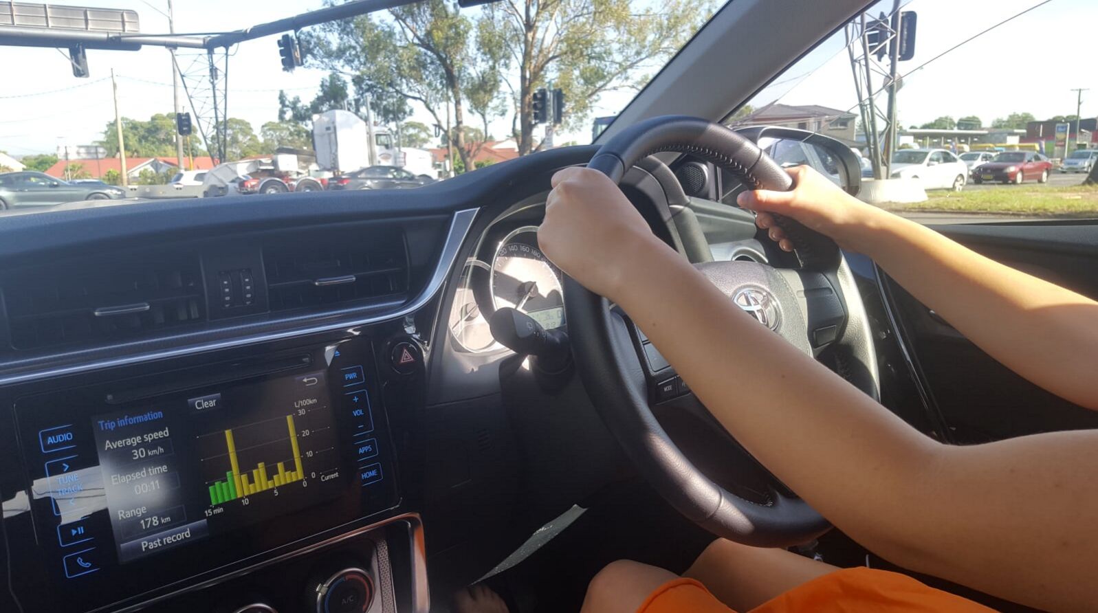 Student driving in Betty's car through Western Sydney